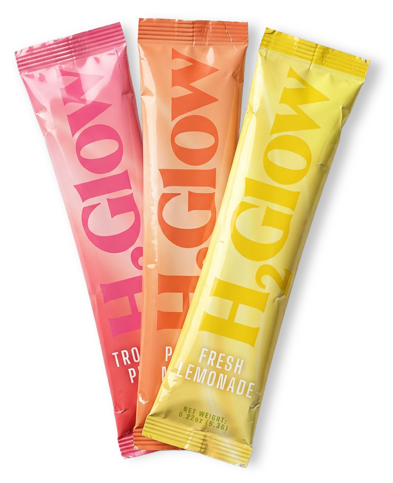 Three colorful drink pouches, pink, orange, and yellow, with bold lettering and Fresh Lemonade text
