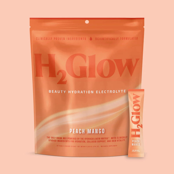 Bright orange H2Glow electrolyte drink variety pack in peach mango flavor, shown with single serving sticks.