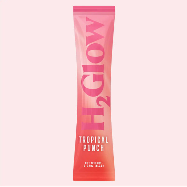 Pink-red candy tube with bold letters forming Tropical Punch and net weight text at the bottom.