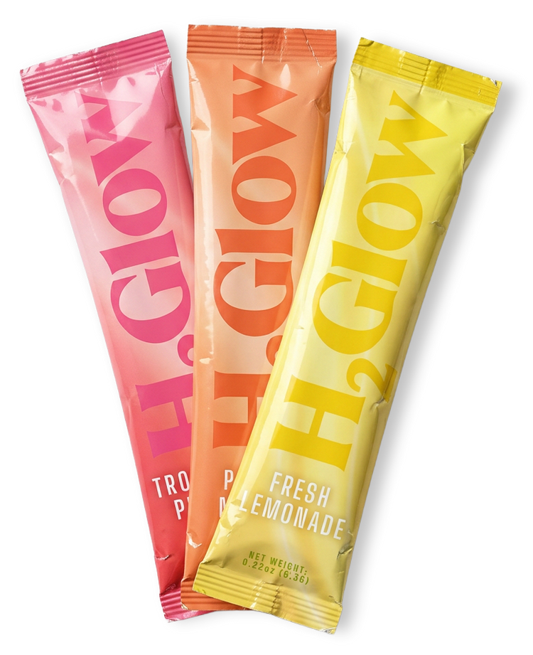 Three colorful drink pouches, pink, orange, and yellow, with bold lettering and Fresh Lemonade text